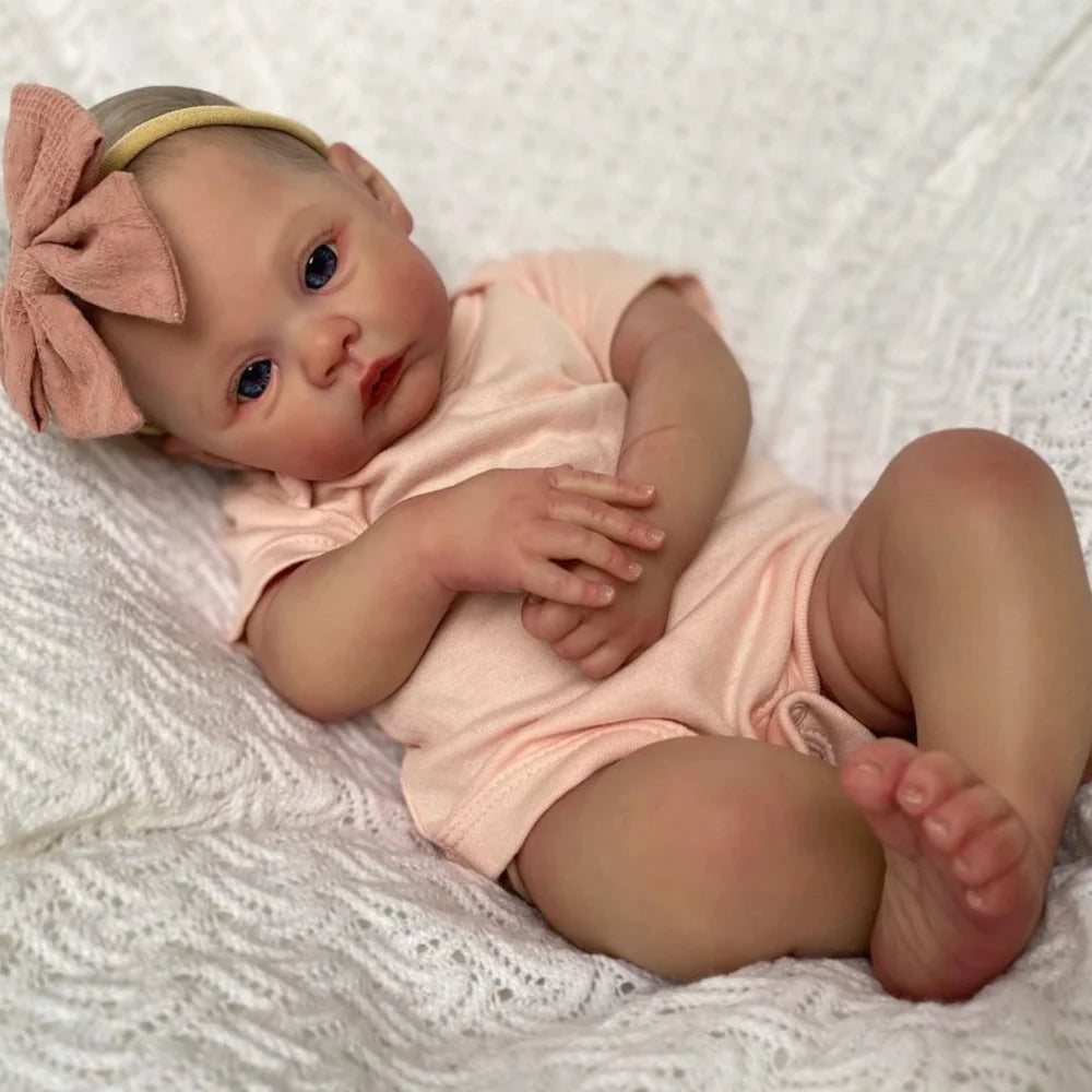 Bebê Reborn Liz de 49cm com roupa rosa clara e laço – boneca realista para presente ou coleção Varialle