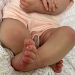Bebê Reborn Liz de 49cm com roupa rosa clara e laço – boneca realista para presente ou coleção Varialle